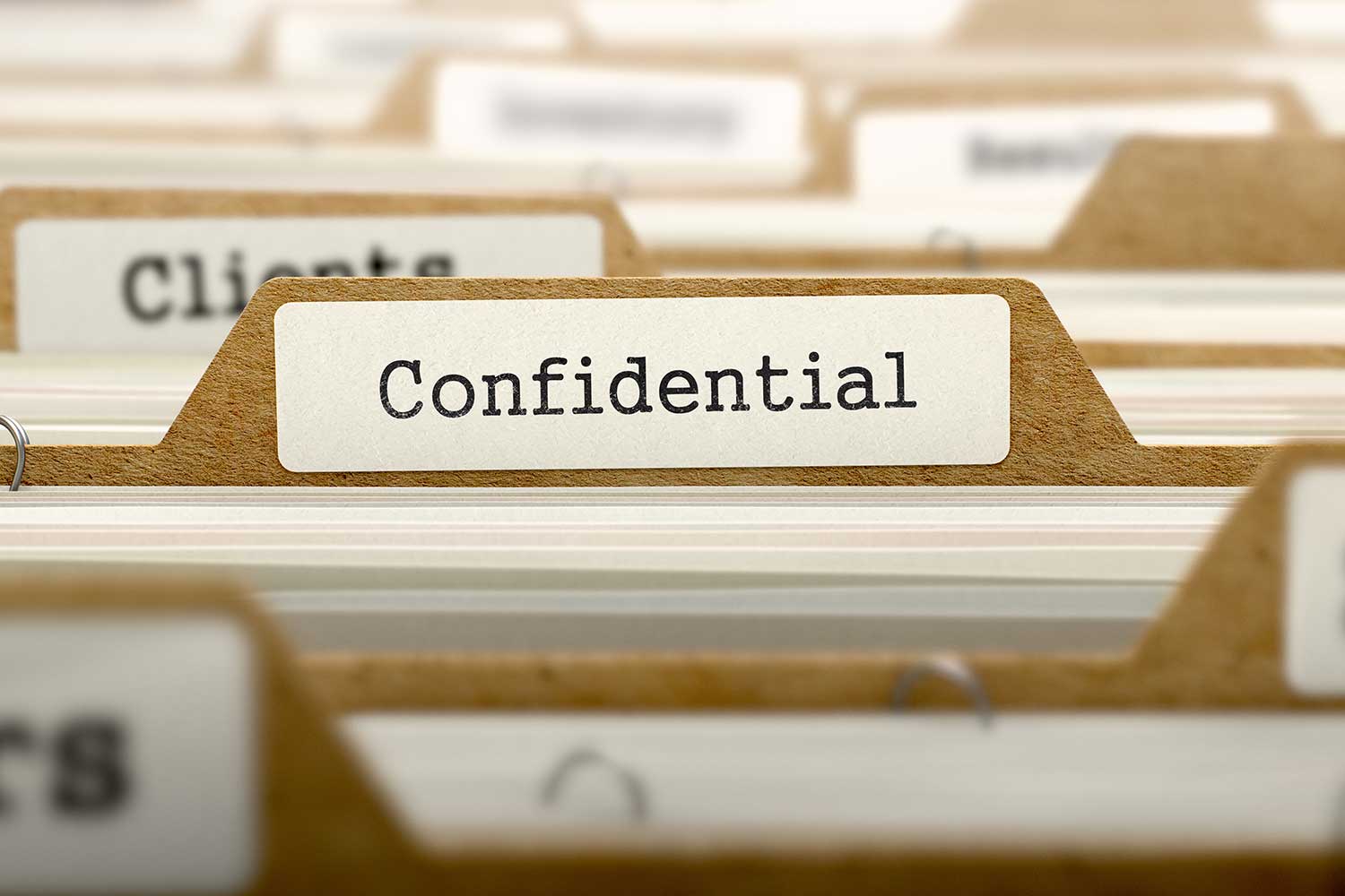 The word "confidential" on a folder.