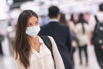 A woman with an N95 mask on