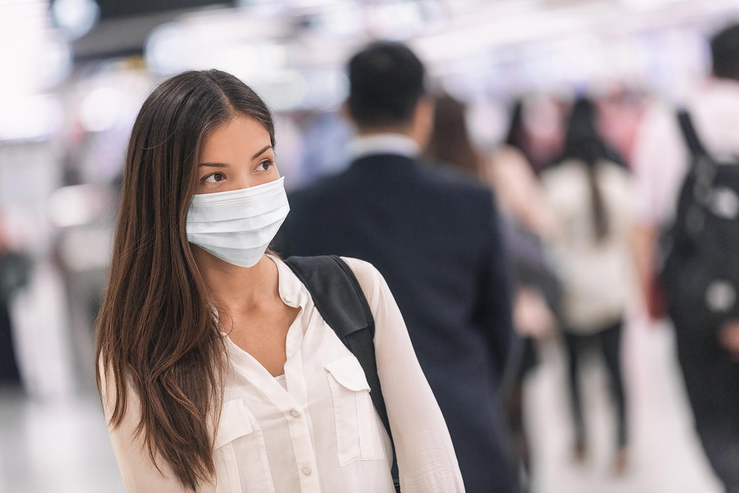 A woman with an N95 mask on