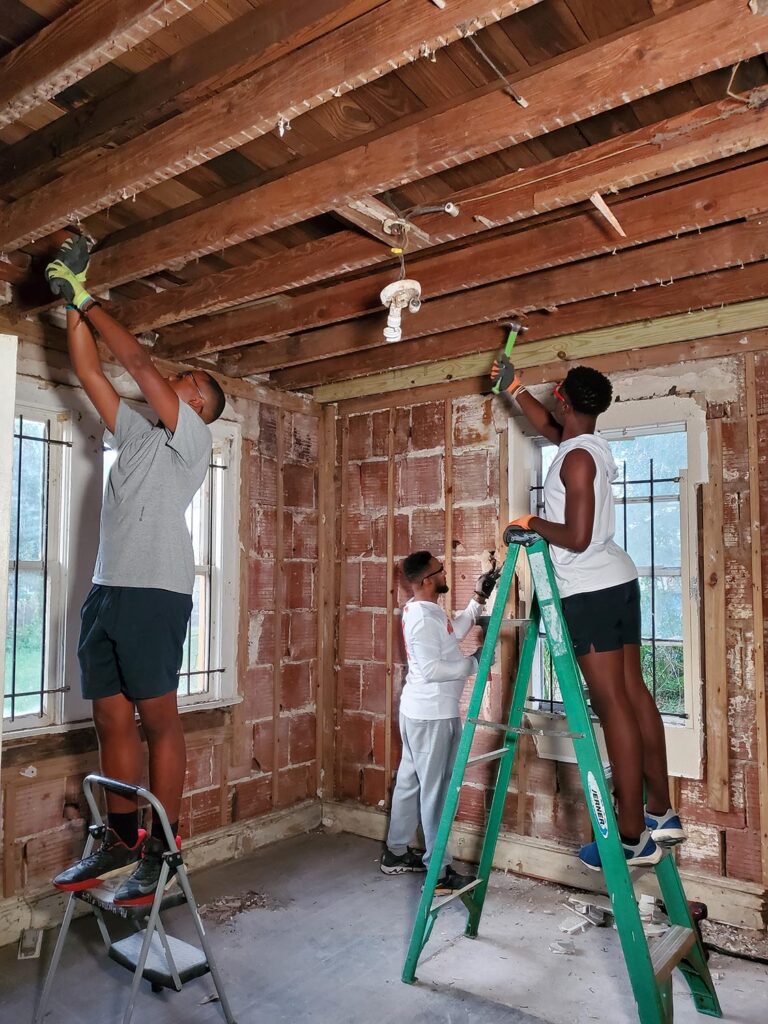 3 people working on a construction project