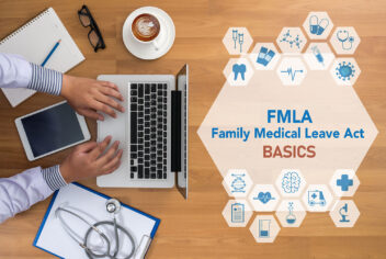 FMLA Family Medical Leave Act Basics on desk with laptop and medical graphics