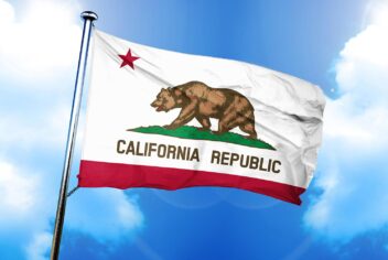 California flag flying against a blue sky