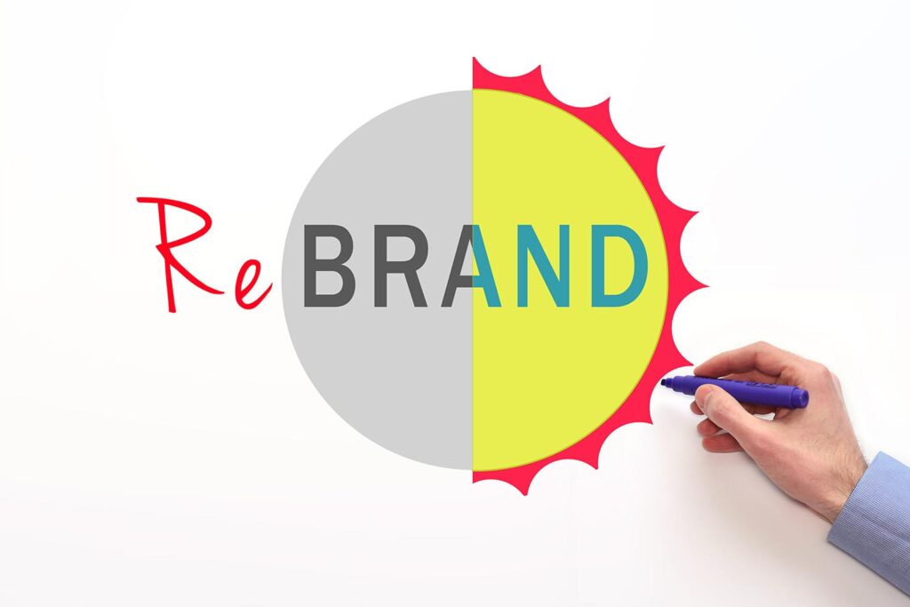 a person drawing the logo for a rebrand