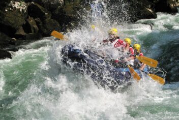 Boat going through white water rapids