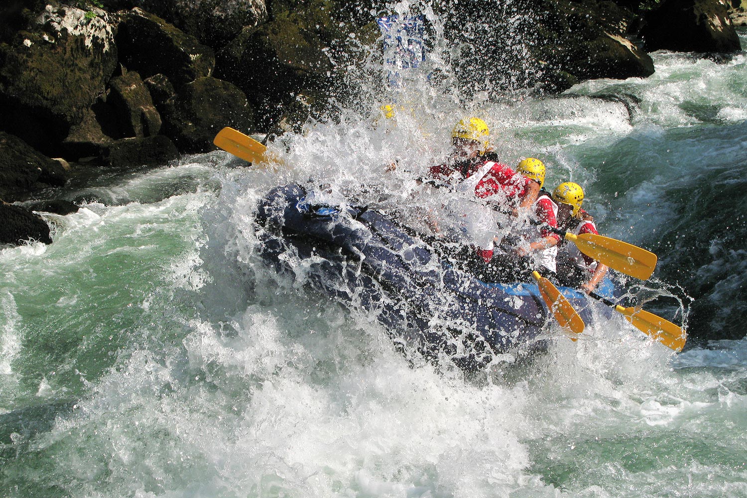 Boat going through white water rapids