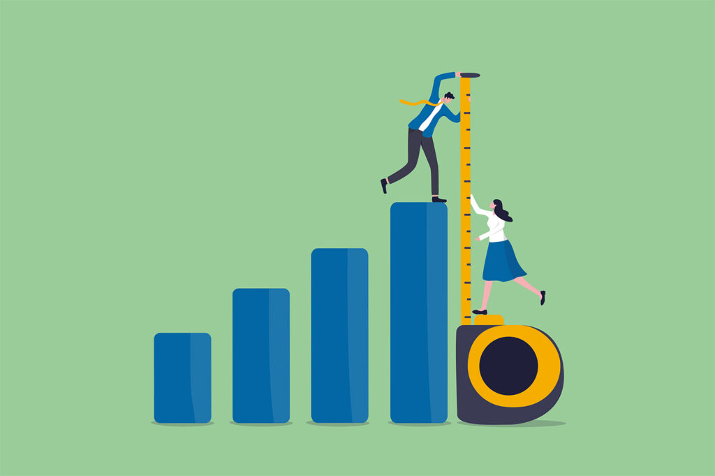 two people measure a bar chart using a tape measure