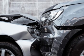 Front end of two cars that have been in a collision