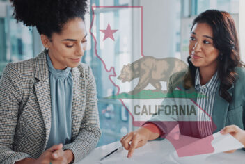 two people looking at a document with a CA flag in background