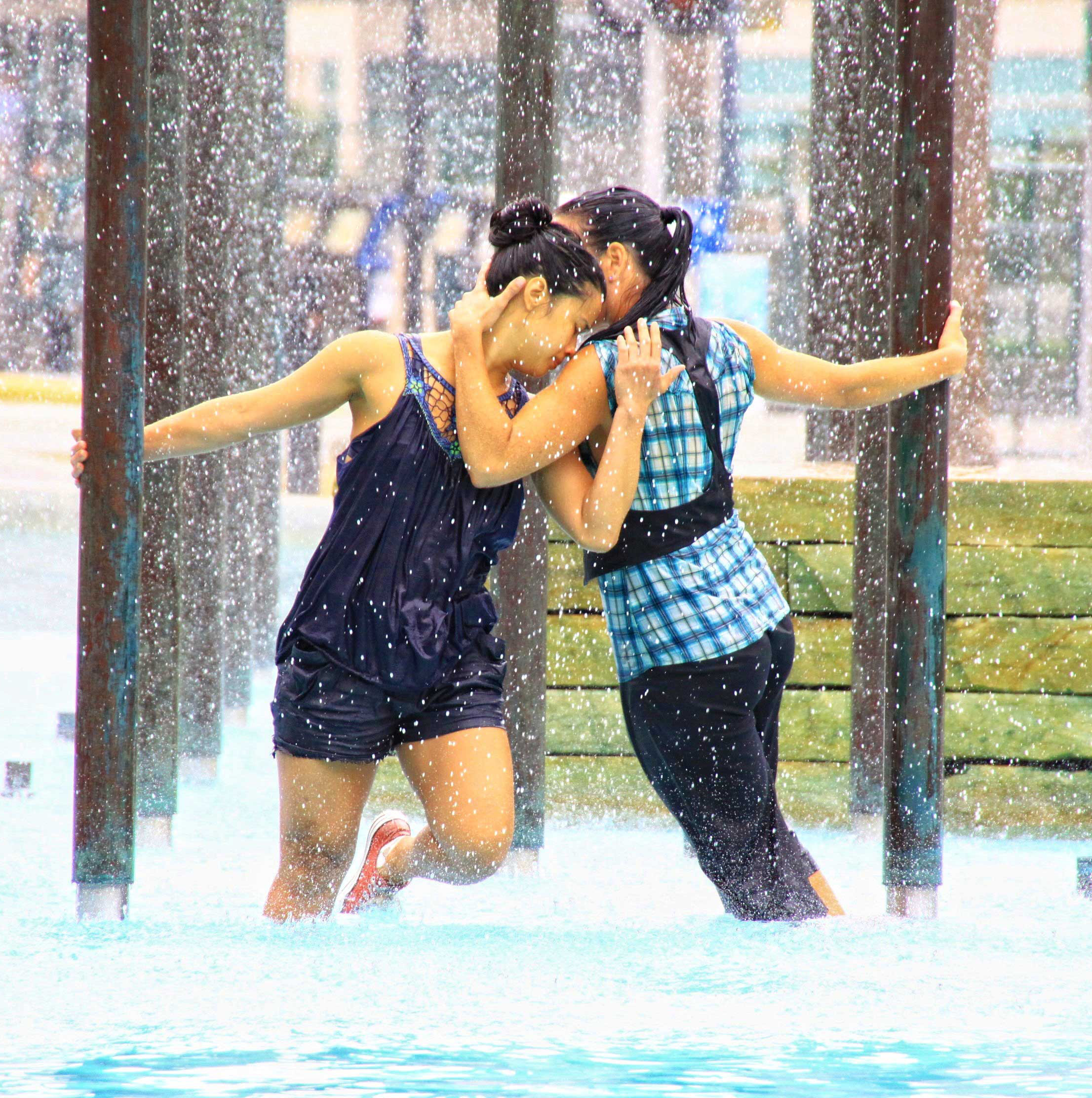 two people dancing in the rain