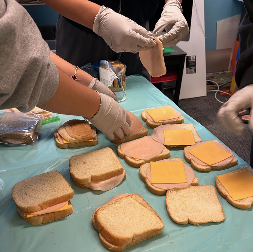 people making sandwiches