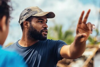 a community organizer coordinating relief efforts after a natural disaster, Illustrating solidarity and emergency response