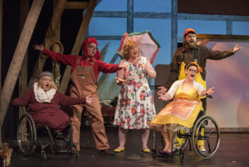 four people performing on a stage