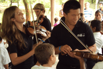 musicians of all ages with stringed instruments