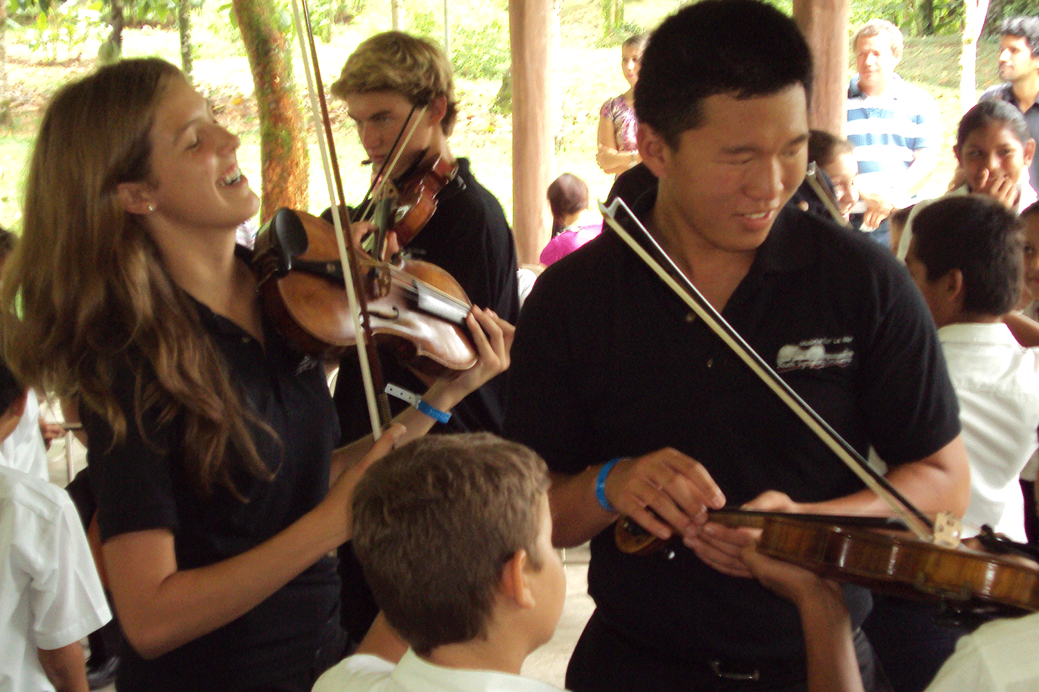 musicians of all ages with stringed instruments