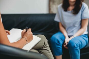 a person sitting in a counseling office