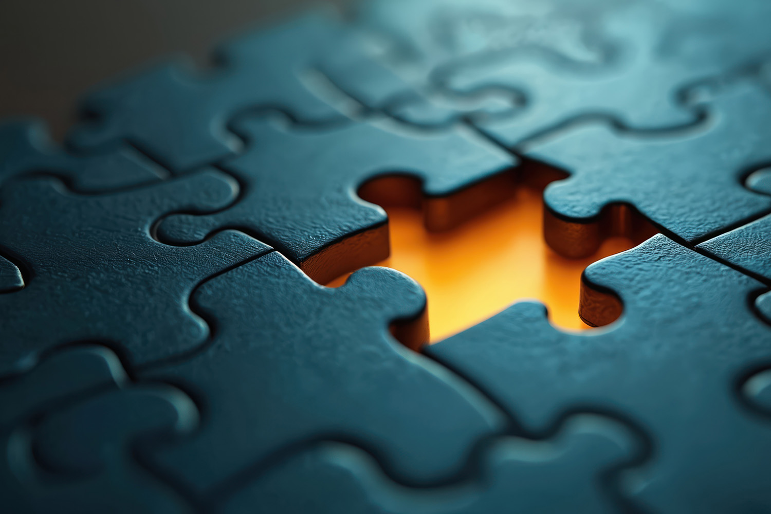 Jigsaw puzzle with one missing piece in the center. 