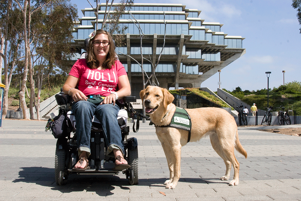 a woman with a service dog outside in front of a building