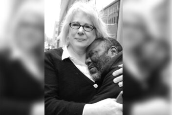 a woman hugging a man