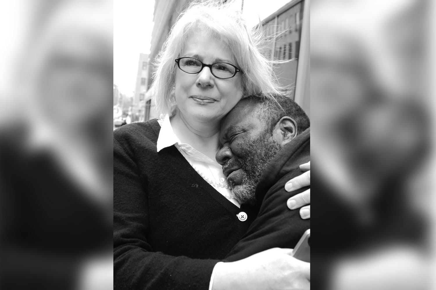 a woman hugging a man