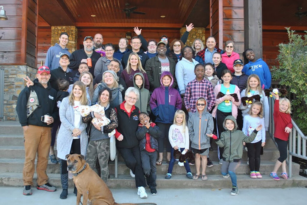 a group of people standing on outdoor steps of a building