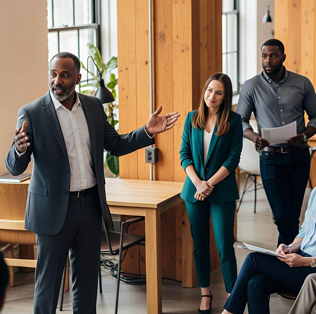 a person speaking to a group of people
