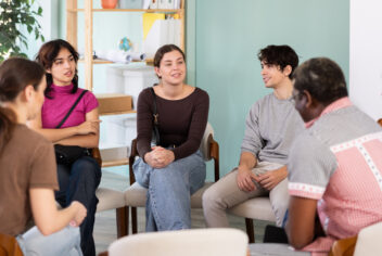 people sitting in a circle talking