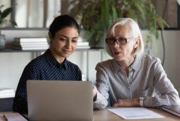 two women and a laptop