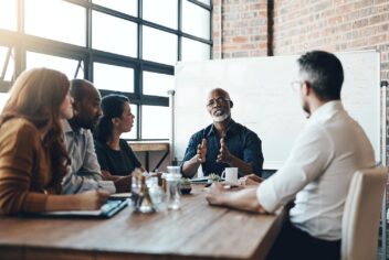 people in a meeting room having a discussion