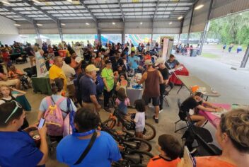 a large group of people in a covered space
