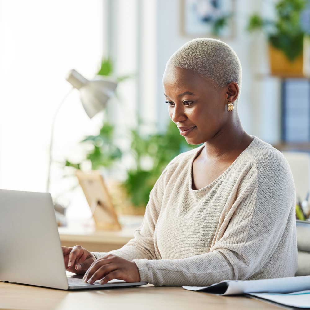 Woman sitting in front of a laptop